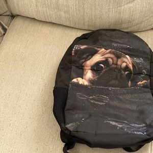 A black pug backpack